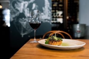 Glass of Stonegaze red wine with food